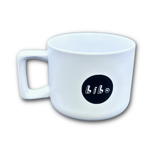 White mug with a black circular logo featuring the word 'bibo' on a white background