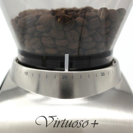 Coffee grinder with coffee beans and 'Virtuoso+' branding on a white background
